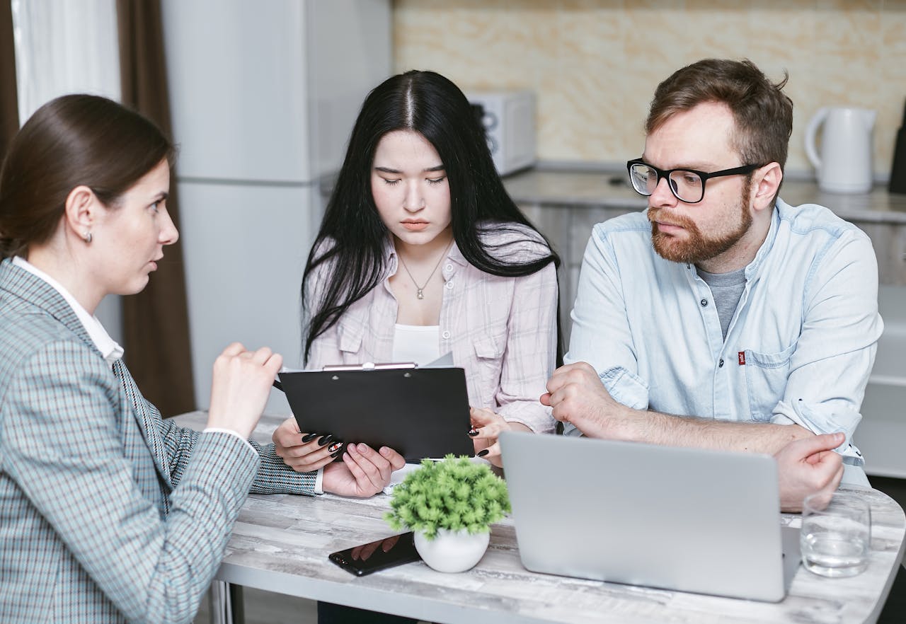 A group of professionals discussing business strategies at a table indoors.